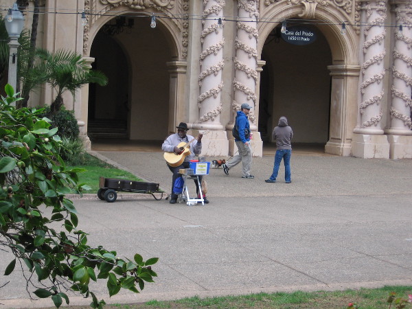 Big Slim plays guitar by the Casa del Prado.