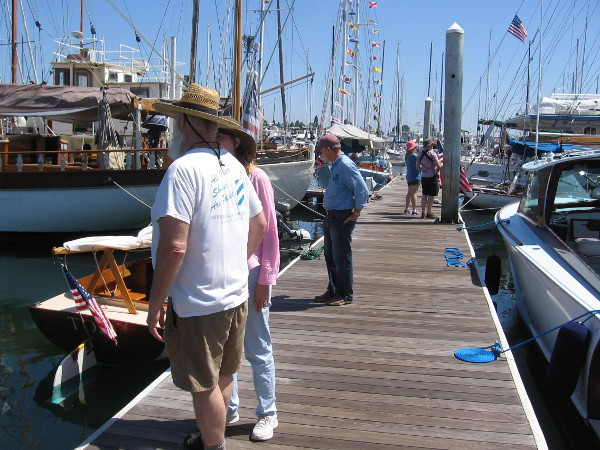 Visitors to the San Diego Wooden Boat Festival check out a variety of interesting vessels.