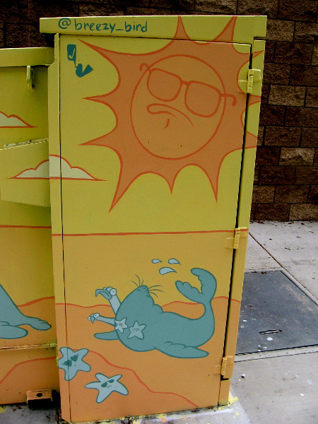 Breezy bird street art on Mission Center Road depicts funny beach scenes.