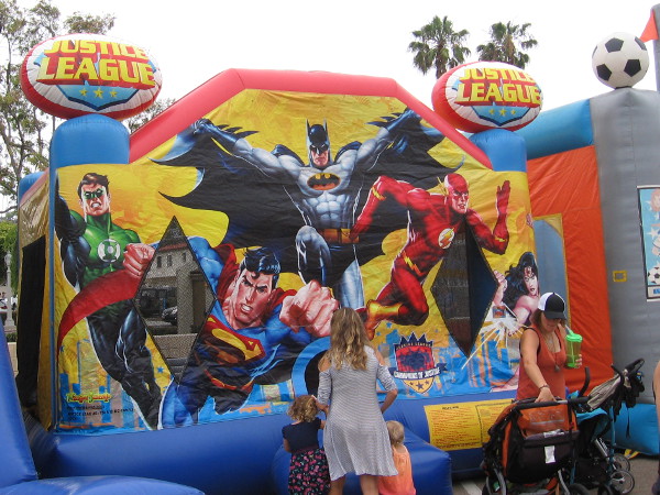 Kids enjoyed a bounce house that featured comic book art.