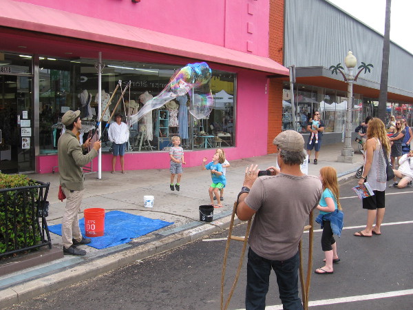 This bubble blower guy is an artist. He creates shimmering joy.