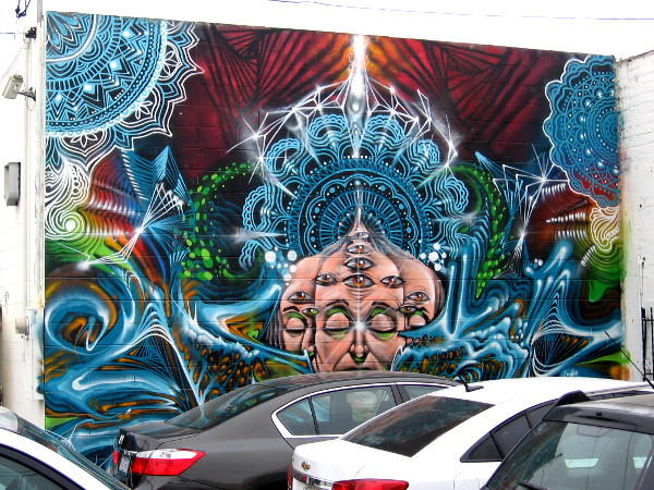 Spiritual revelation is suggested by many eyes and mandalas in an Ocean Beach mural. This cool street art can be experienced in a little-visited alley. The whole can be glimpsed from any place where you stand.