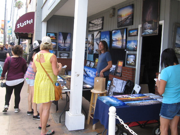 A local photographer was showing off his art to those passing by.