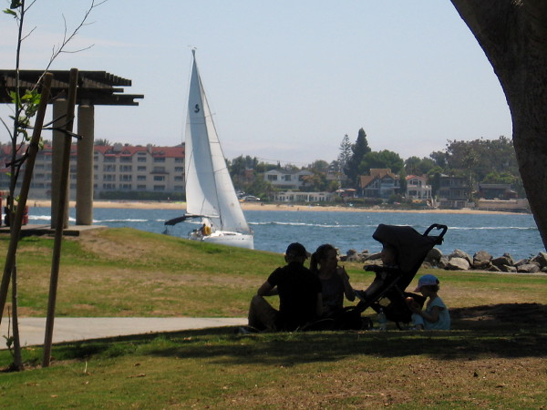 Family and a passing white sail.