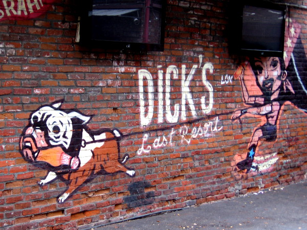 A dog at Dick's Last Resort tugs wildly!