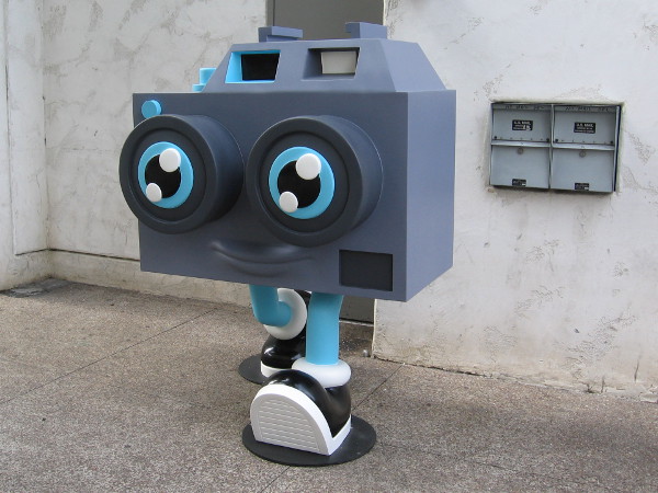 A humorous sculpture stands on the sidewalk outside the Ron English POPaganda art exhibit in San Diego.