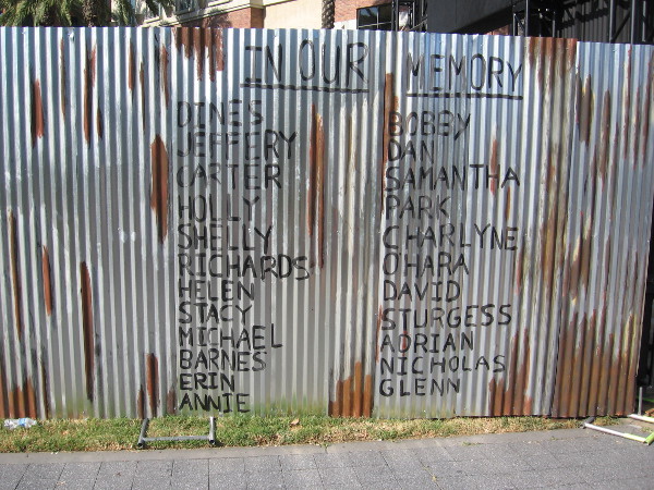 A fence near the Deadquarters entrance lists victims of the undead.