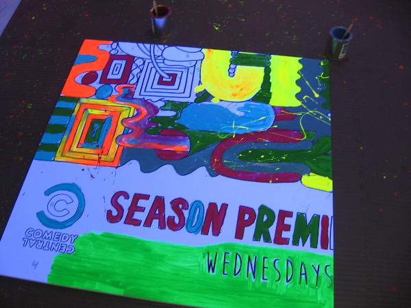 The paint seems to magically glow in the dimly lit room.