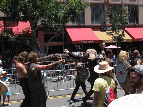 The dead body of a heroic Viking warrior is carried down Fifth Avenue for Comic-Con.
