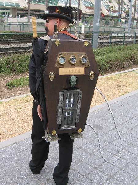 A steampunk Ghostbuster shows me his very cool proton pack.