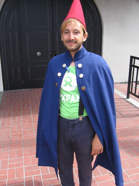 This guy is raising awareness about the charitable organization Oxfam. They are providing help for refugees.