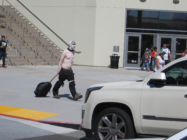 Some ordinary person is just walking along heading to the hotel.