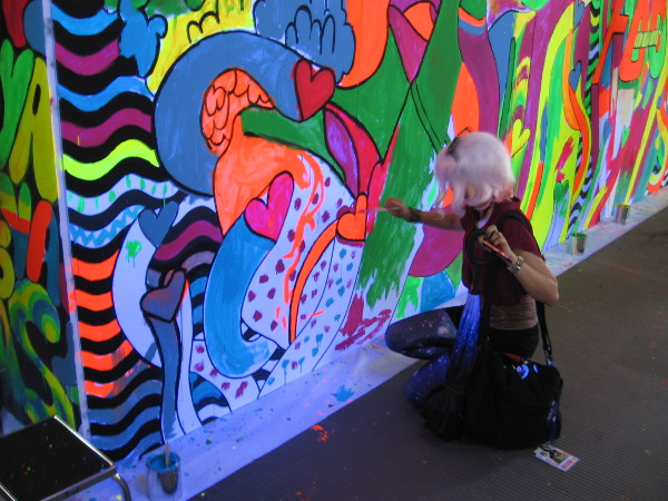 Fan of the Comedy Central show Broad City paints a wall during 2017 San Diego Comic-Con.