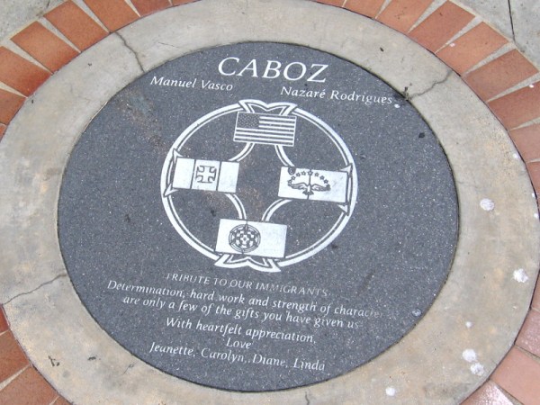 Plaque in the sidewalk is a Tribute to our Immigrants. Determination, hard work and strength of character are only a few of the gifts you have given us.