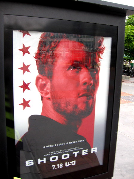 A poster promoting Shooter on USA Network near the Tin Fish.