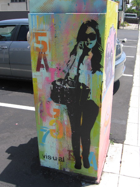 A cool lady seems to stand on the sidewalk.