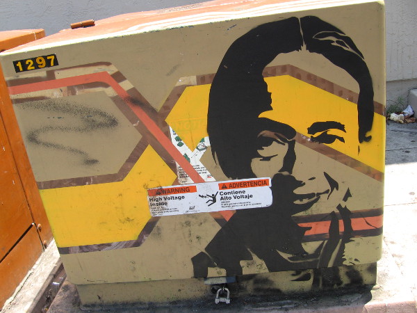 A smiling face painted on a transformer box along Adams Avenue.