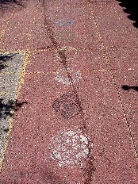 Stenciled mandalas line the sidewalk near Pilgrimage of the Heart Yoga.