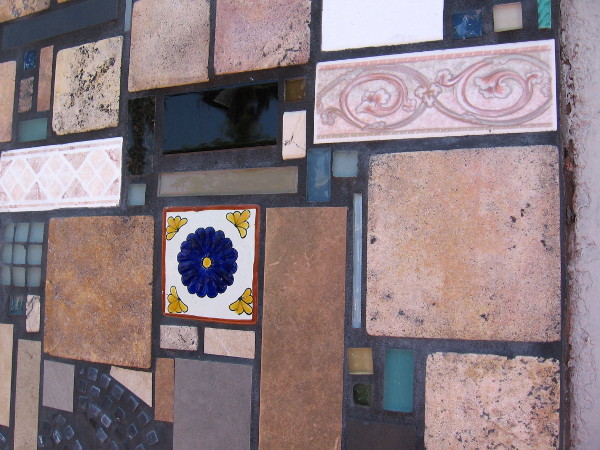 A mosaic of different tiles outline the front of some stores along Adams Avenue in Normal Heights.