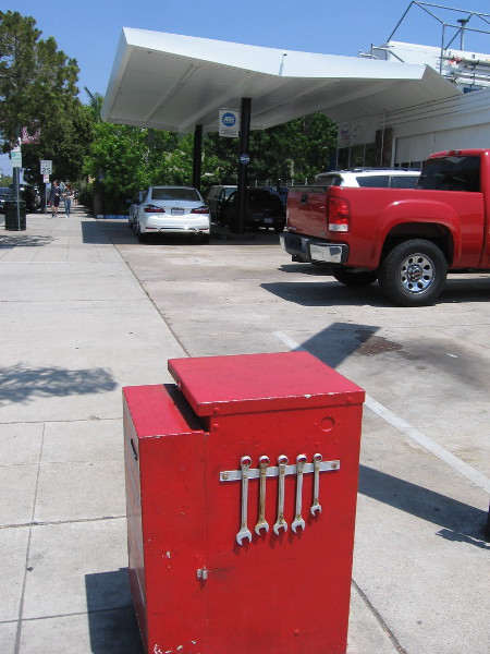 Real wrenches have been affixed to this utility box near an auto repair shop!