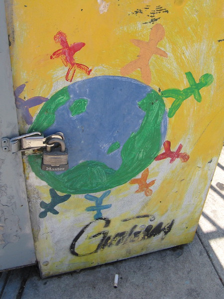 Many colorful stick figures around the planet Earth.