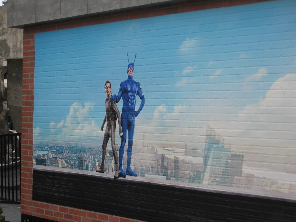 Graphic on rear of The Tick Takeover building shows Arthur Everest and The Tick.