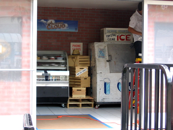 The inside of the building appears to be a small store.