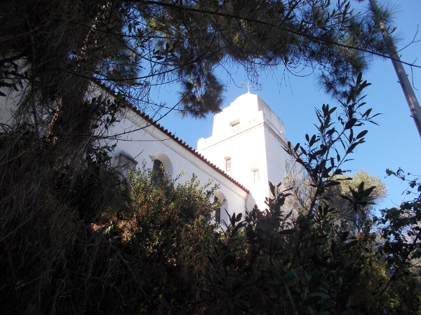 View of the Serra Museum through trees atop Presidio Hill, near the spot where European civilization first took root in California in 1769.