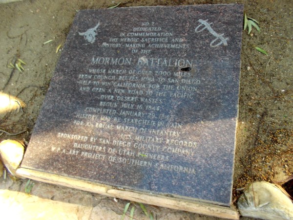 Plaque by mural, commemorating the heroic sacrifice and history-making achievements of the Mormon Battalion.