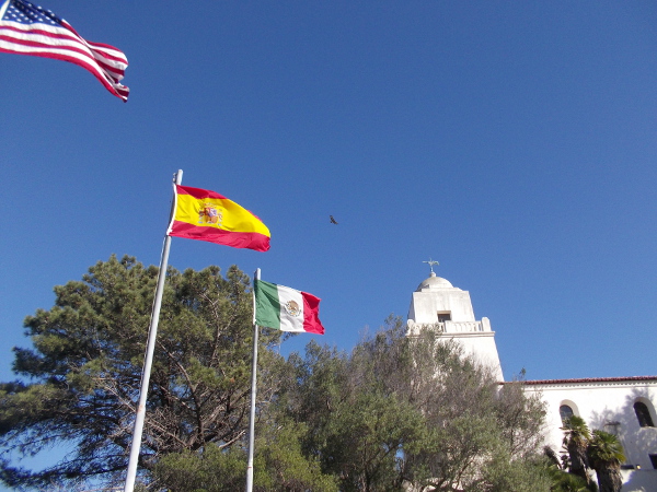 Flags of the United States, Spain and Mexico fly atop Presidio Hill, birthplace of California. Here many chapters of history are remembered.