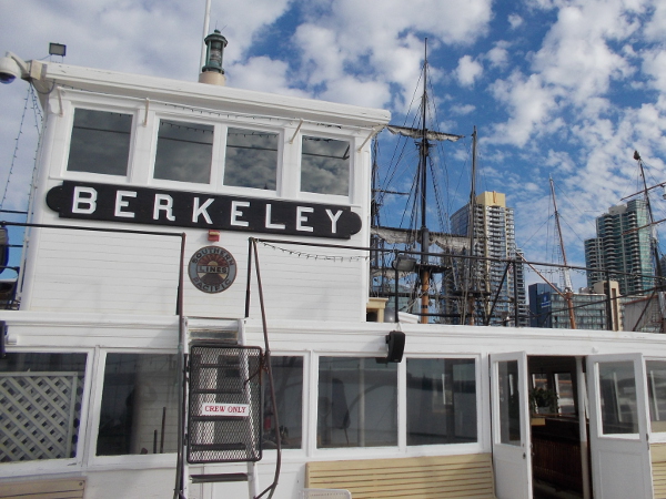 Downtown San Diego skyscrapers and masts of HMS Surprise and Star of India can be seen in this photo of the upper passenger deck and one of two pilot houses.