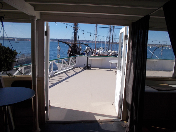 Gazing from the passenger deck outside toward San Diego Bay. Other museum ships, including Californian and San Salvador, are docked along a float west of the Berkeley.