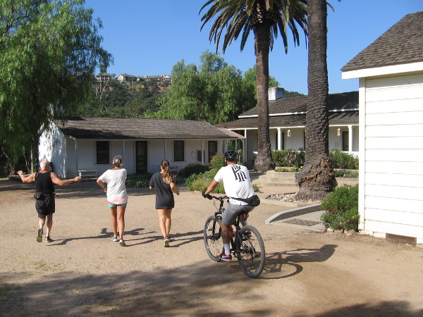 Jogging and biking past the historic adobe ranch house in Los Peñasquitos Canyon Preserve.