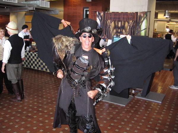 A guy with a super cool steampunk outfit spread his mechanical wings for a photo as I entered the library!