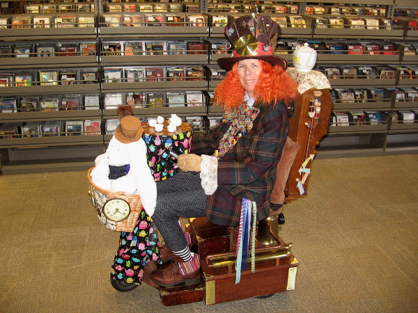 It's The Mad Hatter! And her mobile table is set for tea! Or perhaps A Moveable Feast. (Okay, I'm sorry--it's the library.)