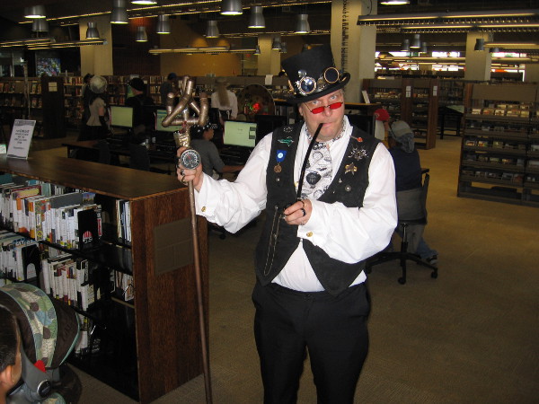 I believe this guy said he's Gandalf the Brass. His staff emits different colored light, depending on the magic. Should he defeat a Balrog, he might become Gandalf the Gold.