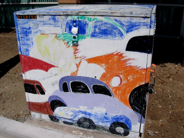 Street art shows colorful cars.