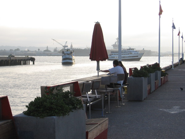Meanwhile, this afternoon during my walk, I saw some folks enjoying the pier, watching two harbor cruise ships coming in from the bay.