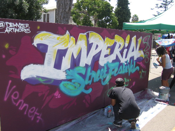 Anyone could add their own creative touch to this cool Imperial Street Festival spray paint mural!