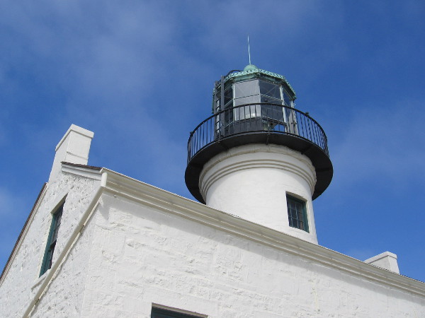 Built in 1855 at the end of the Point Loma peninsula, above the entrance to San Diego Bay, the old lighthouse used to guide sailors to safety with a powerful fresnel lens.