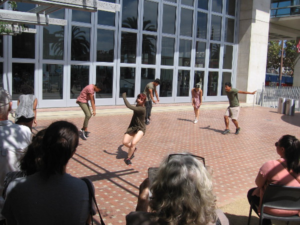 The dancers come outside and engage the audience.