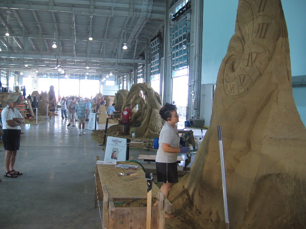 Sue McGrew of Tacoma, Washington works on some monumental sand art that represents the continuum of time.
