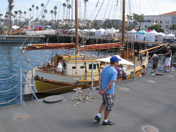 Someone walks along near the Norwegian double ended ketch Cloudia.