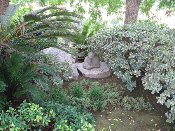 Why is this small sculpture of a child in the Japanese Friendship Garden? Nobody knows. Someone placed it here mysteriously many years ago.