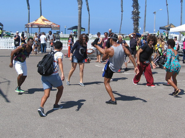 More people join in, and they're really kicking it up!