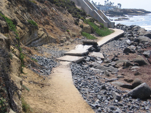 We've almost reached the end of our walk. The concrete pathway ahead has either been undermined by water, or intentionally made into a ramp for thrill seekers.