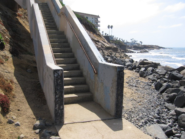 At the foot of old stairs that climb up to Orchard Avenue.