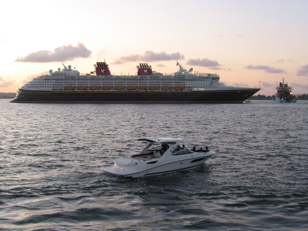 The Disney Wonder backs away from the B Street Pier as it departs on another cruise. Many ships and boats cross paths on San Diego Bay.