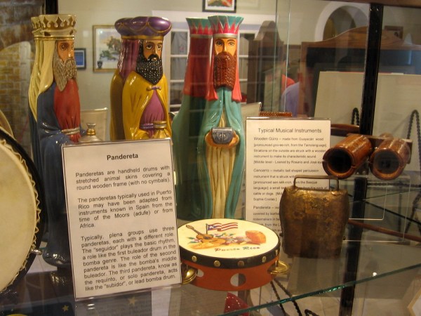 Among the many displays inside the House of Puerto Rico cottage are panderetas, cencerros and other musical instruments.