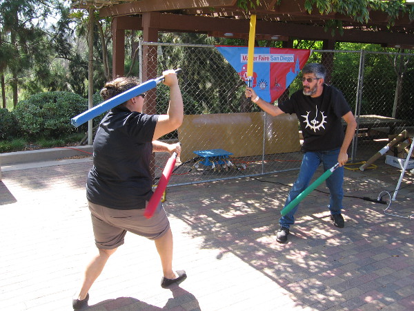 Members of the San Diego Sabers demonstrate mock combat using foam attachments. Together they've got enough lightsabers to take on General Grievous!